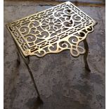 A 19TH CENTURY PIERCED BRASS AND BRONZE TRIVET On cabriole legs with turned stretcher. (32cm x