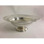 BAKER BROTHERS, A 1920'S SILVER BOWL Having a pierced rim, raised on a socle base. (h 10cm)