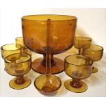 A 20TH CENTURY AMBER ART GLASS PUNCH BOWL AND GLASSES SET To include a bowl with socle on platform