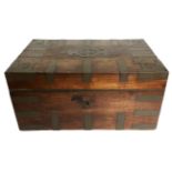 AN EARLY 19TH CENTURY TEAK COLONIAL CAMPAIGN CHEST The brass mounted top opening to reveal a