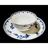 AN 18TH CENTURY WORCESTER PORCELAIN TEA BOWL AND SAUCER Hand painted with underglaze blue floral