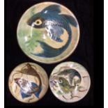 A COLLECTION OF THREE 20TH CENTURY SPANISH MAJOLICA FISH PLATES Each decorated with a stylized fish,