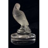 LALIQUE, FRANCE, A 20TH CENTURY FROSTED GLASS PAPERWEIGHT Carved as an exotic bird on a raised