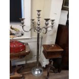 A LARGE CHROME FLOOR STANDING CANDELABRA Having five sconces, raised on a circular support and base.