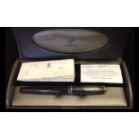 A VINTAGE PARKER FOUNTAIN PEN In glass black and graphite grey, cased with papers, from the