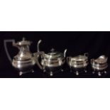 AN EARLY 20TH CENTURY FOUR PIECE TEA SERVICE Comprising teapot, sugar and cream, hallmarked