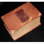 AN 18TH CENTURY LEATHER BOOK Titled 'The Book of Common Prayer and the Administrations of Sacraments