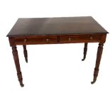 IN THE MANNER OF GILLOWS, A 19TH CENTURY MAHOGANY WRITING TABLE With two drawers, raised on turned