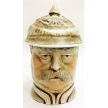AN IMPERIAL GERMAN PORCELAIN MILITARY BEER STEIN Modelled as the Kaiser with Pickelhaub helmet,
