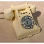 A MID 20TH CENTURY WHITE BAKELITE TELEPHONE With rotary dial.