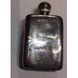 AN EARLY 20TH CENTURY CURVED SILVER HIP FLASK With screw cap and removable cup to base, hallmarked