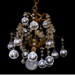 A PAIR OF EARLY 20TH CENTURY GILT BRONZE CHANDELIERS Hung with crystal prism drops. (55cm)