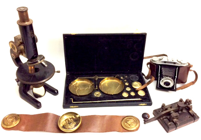 AN EARLY 20TH CENTURY EBONISED BRASS MICROSCOPE Marked 'C. Baker', together with a cased set of