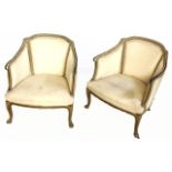 A PAIR OF 19TH CENTURY BEDROOM CHAIRS With painted frames and cream upholstery, raised on cabriole