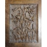 A CARVED OAK PANEL With poker work decoration and daffodils, together with a pair of brass wall