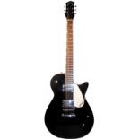A GRETSCH ELECTROMAGNETIC GUITAR With black gloss finish, floating white scratch plate, and a