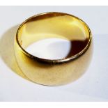 A VINTAGE 22CT GOLD WEDDING RING Of plain wide band form (size H).