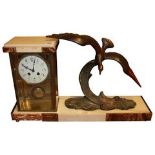 AN ART DECO BRONZE AND MARBLE FIGURAL MANTLE CLOCK The four glass case set with a circular white