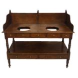 A 19TH CENTURY AND LATER MAHOGANY TWO TIER DOUBLE WASHSTAND With an arrangement of seven drawers