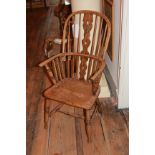 A VICTORIAN ASH HOOPBACK WINDSOR CHAIR With picked back and solid seat, raised on turned legs joined