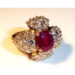A FRENCH YELLOW METAL, RUBY AND DIAMOND RING Stylised floral form with single ruby flanked by 44