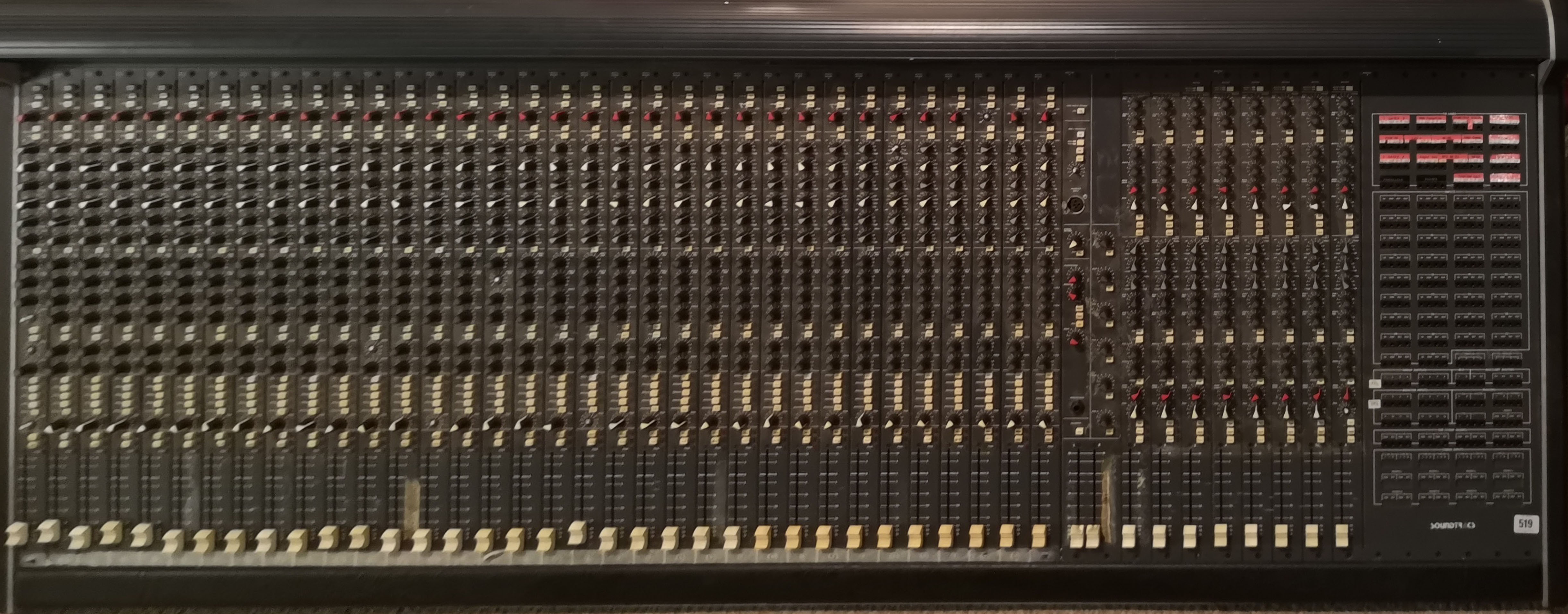 A SOUNDTRACS MRX SERIES ANALOG 32 CHANNEL MIXER Complete with stand and protective cover.