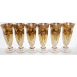 A VINTAGE SET OF SIX VENETIAN MURANO GLASS AND GILT CHAMPAGNE FLUTES Tapering gold tone body with