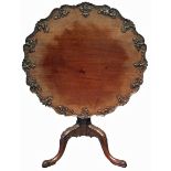 AN IMPORTANT 18TH CENTURY MAHOGANY TEA TABLE The scallop top finely and uniquely carved with