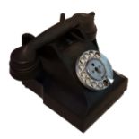 A MID 20TH CENTURY BLACK BAKELITE TELEPHONE With rotary dial.