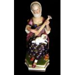 DERBY, A 19TH CENTURY PORCELAIN FIGURE Seated lady playing a mandolin. (h 16cm)