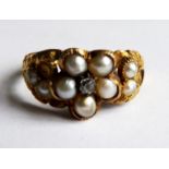AN 18CT GOLD, DIAMOND AND PEARL RING With single diamond flanked by pearls and incised shoulders (
