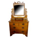 A 19TH CENTURY PINE DRESSING CHEST Having a bevelled glass mirror above an arrangement of six