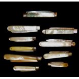 TEN GEORGIAN AND LATER SILVER FRUIT KNIVES With hallmarked folding blades, some with incised
