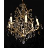 A FRENCH EARLY 20TH CENTURY SIX BRANCH GLASS CHANDELIER Hung with numerous crystal drops. (72cm)