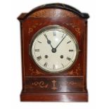 A 19TH CENTURY MAHOGANY AND INLAID MANTLE CLOCK The painted dial with Roman numeral chapter,