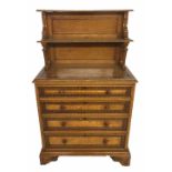 MANNER OF GILLOWS, AN EARLY 19TH CENTURY FIGURED ASH AND EBONY PIER CABINET The carved two tier back