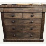 AN EARLY VICTORIAN MAHOGANY CHEST Of two short and four long drawers, flanked by columns. (128cm x