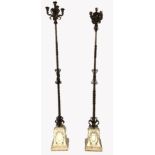 TWO 19TH CENTURY WROUGHT FIVE BRANCH CANDELABRA With scrollwork decoration on barley twist