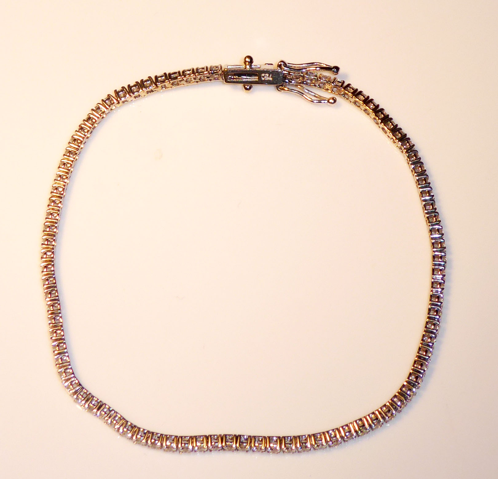 AN 18CT WHITE GOLD AND DIAMOND TENNIS BRACELET Set with approximately 90 round cut diamonds. (length - Image 2 of 2