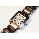 CARTIER, A TANK AUTOMATIC WRISTWATCH The silvered dial with Roman numeral chapter ring and blue