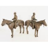 TWO 19TH CENTURY WHITE METAL STATUES OF GENTLEMEN ON HORSEBACK. (10cm x 9.5cm)