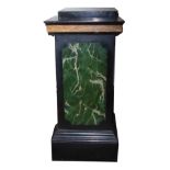 A PAIR OF EARLY 20TH CENTURY WOODEN PEDESTAL COLUMNS Having green marble effect on a black ground,