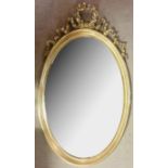 A FRENCH DESIGN OVAL MIRROR The giltwood frame with ribbon motif, together with carved pier mirror
