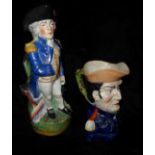 TWO 19TH CENTURY STAFFORDSHIRE POTTERY TOBY JUGS Standing figure of Admiral Lord Nelson and head and