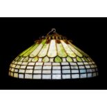 TIFFANY STUDIOS, AN EARLY 20TH CENTURY LEADED GLASS CEILING LIGHT The bronze hanger set with