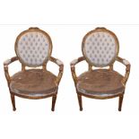 A PAIR OF 19TH CENTURY CARVED GILTWOOD FAUTELUILS BUTTON BACK ARMCHAIRS Raised on turned and