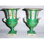 A PAIR OF 19TH CENTURY CONTINENTAL PORCELAIN CAMPAIGN VASES Applied with twin handles and floral