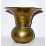 AN ANTIQUE BRONZE SPITTOON Having a flared tapering rim with curved base. (approx 13cm)