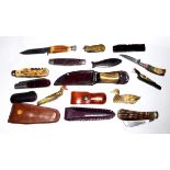A COLLECTION OF FOLDING KNIVES Novelty examples in the form of fish, a duck and a cat, some with