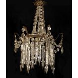 A LATE 19TH CENTURY GILT METAL CHANDELIER Hung with numerous prisms and beaded swags. (50cm)